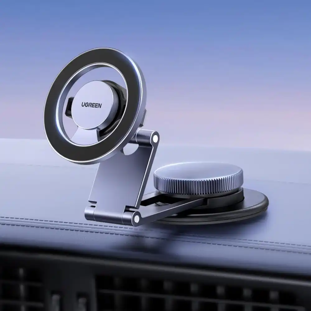 UGREEN 45577 Magnetic Dashboard Car Phone Mount made of metal, attached to a car dashboard.